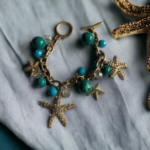 Really beautiful brushed gold starfish charm bracelet.